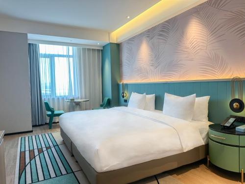 Imagen de la habitación del Hotel Paradiso Jiamusi. Foto 14