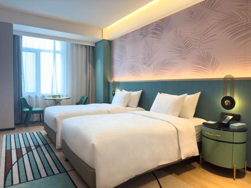 Imagen de la habitación del Hotel Paradiso Jiamusi. Foto 15