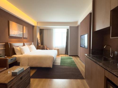 Imagen de la habitación del Hotel Paradiso Jiamusi. Foto 18