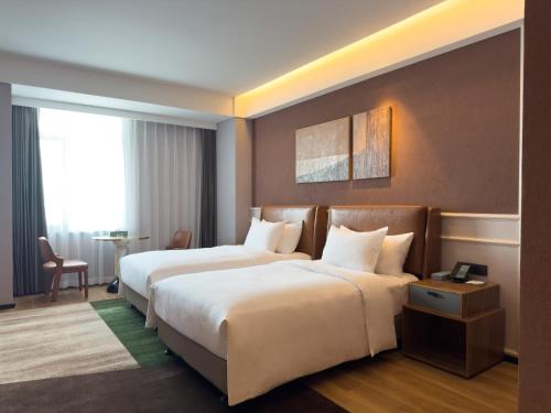 Imagen de la habitación del Hotel Paradiso Jiamusi. Foto 19