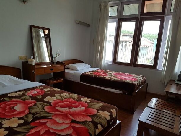 Imagen de la habitación del Hotel Parami Motel. Foto 19