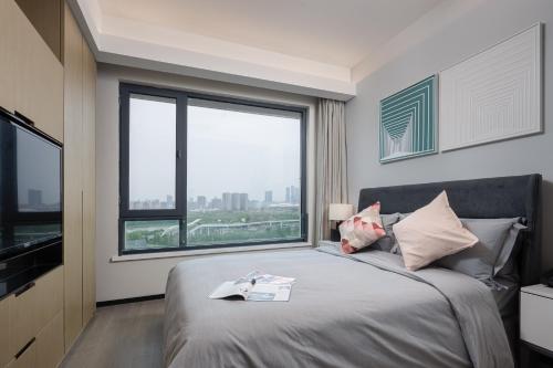 Imagen de la habitación del Hotel ParcVue Residence Nanjing. Foto 19