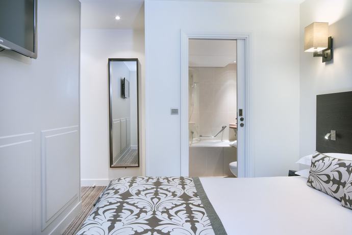 Imagen de la habitación del Hotel Paris Louvre Opéra. Foto 7