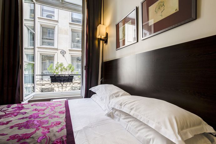 Imagen de la habitación del Hotel Paris Louvre Opéra. Foto 16