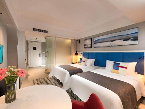 Imagen de la habitación del Hotel Park Inn by Radisson Beihai Silver Beach Wanda Plaza. Foto 12