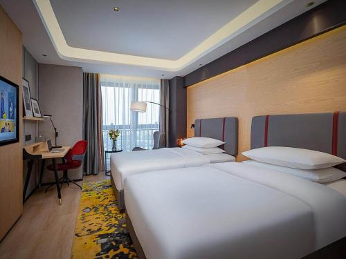 Imagen de la habitación del Hotel Park Inn by Radisson Chongqing Yuelai International Expo Center. Foto 15