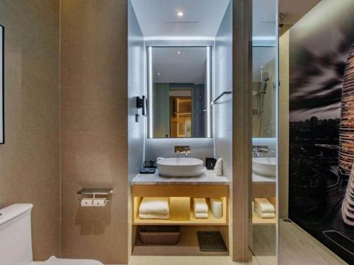 Imagen de la habitación del Hotel Park Inn by Radisson Chongqing Yuelai International Expo Center. Foto 19
