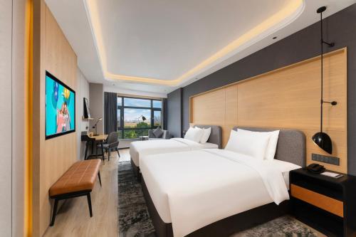 Imagen de la habitación del Hotel Park Inn by Radisson Datong Ancient Town Heyangmen. Foto 15