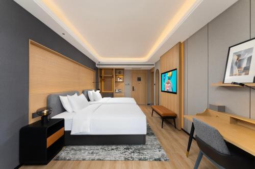 Imagen de la habitación del Hotel Park Inn by Radisson Datong Ancient Town Heyangmen. Foto 16