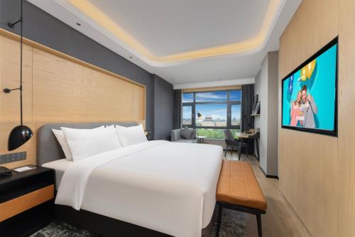 Imagen de la habitación del Hotel Park Inn by Radisson Datong Ancient Town Heyangmen. Foto 19