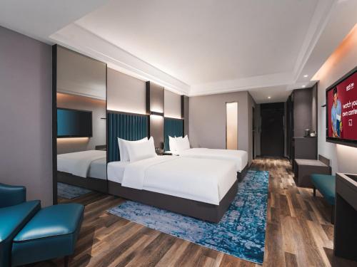 Imagen general del Hotel Park Inn by Radisson Hanzhong Central Square & High speed rail station. Foto 4