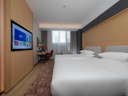 Imagen de la habitación del Hotel Park Inn by Radisson Jilin Beishan Park&Songhua River. Foto 14