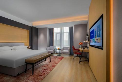 Imagen de la habitación del Hotel Park Inn by Radisson Jilin Beishan Park&Songhua River. Foto 19