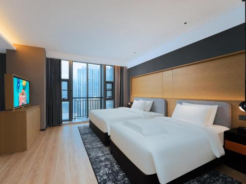Imagen de la habitación del Hotel Park Inn by Radisson Nanjing North Zhongshan Road. Foto 14