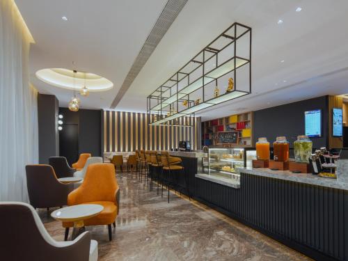 Imagen del bar/restaurante del Hotel Park Inn by Radisson Nanjing North Zhongshan Road. Foto 10