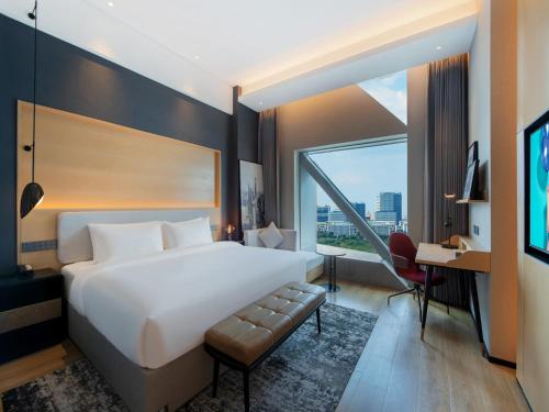 Imagen de la habitación del Hotel Park Inn by Radisson Shanghai Shanghai Middle Jiasong Road Outlets. Foto 16