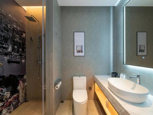 Imagen de la habitación del Hotel Park Inn by Radisson Shanghai Shanghai Middle Jiasong Road Outlets. Foto 17