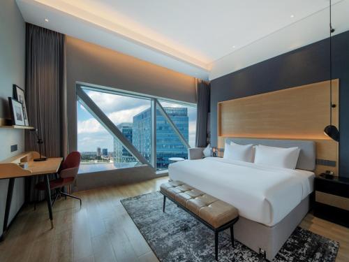 Imagen de la habitación del Hotel Park Inn by Radisson Shanghai Shanghai Middle Jiasong Road Outlets. Foto 18