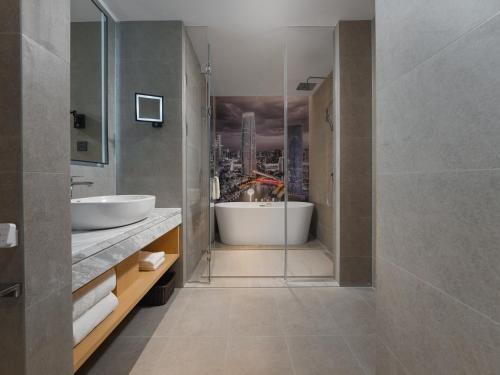 Imagen general del Hotel Park Inn by Radisson Tianjin Jinghai Wanda Plaza. Foto 1
