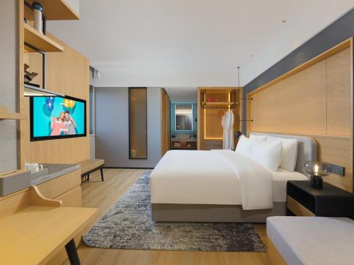 Imagen general del Hotel Park Inn by Radisson Tianjin Jinghai Wanda Plaza. Foto 3