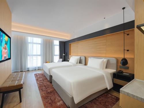 Imagen de la habitación del Hotel Park Inn by Radisson Tianjin Jinghai Wanda Plaza. Foto 13