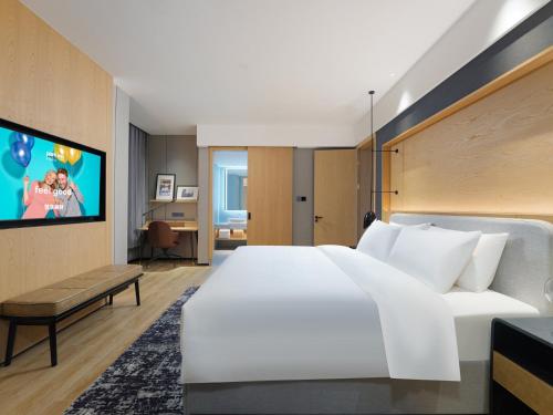 Imagen de la habitación del Hotel Park Inn by Radisson Tianjin Jinghai Wanda Plaza. Foto 19