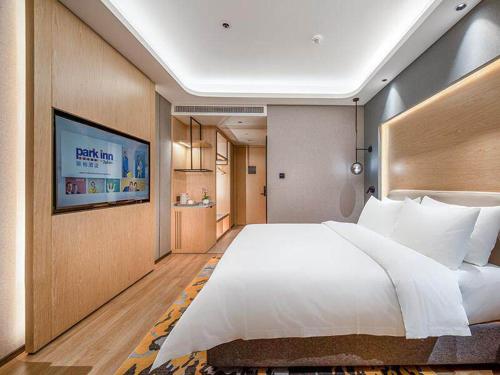 Imagen de la habitación del Hotel Park Inn by Radisson Tongling The City Core. Foto 17