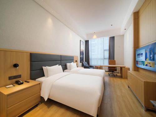 Imagen de la habitación del Hotel Park Inn by Radisson Wenzhou Longwan International Airport Wanda Plaza. Foto 11