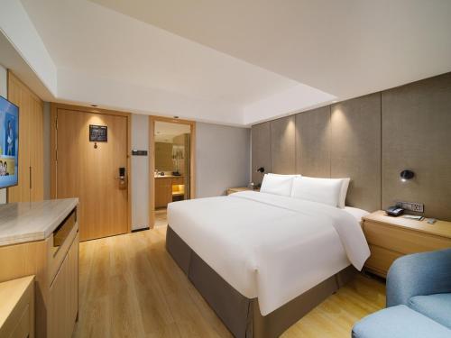 Imagen de la habitación del Hotel Park Inn by Radisson Wenzhou Longwan International Airport Wanda Plaza. Foto 12