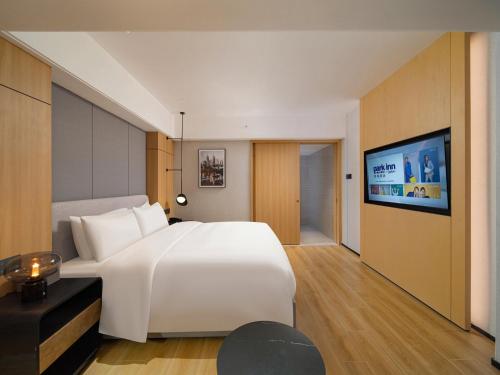 Imagen de la habitación del Hotel Park Inn by Radisson Wenzhou Longwan International Airport Wanda Plaza. Foto 13