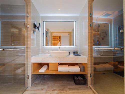 Imagen de la habitación del Hotel Park Inn by Radisson Wenzhou Longwan International Airport Wanda Plaza. Foto 14