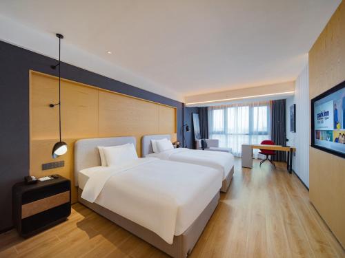 Imagen de la habitación del Hotel Park Inn by Radisson Wenzhou Longwan International Airport Wanda Plaza. Foto 16