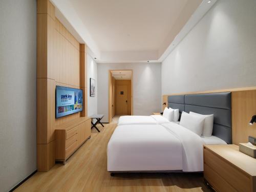 Imagen de la habitación del Hotel Park Inn by Radisson Wenzhou Longwan International Airport Wanda Plaza. Foto 17