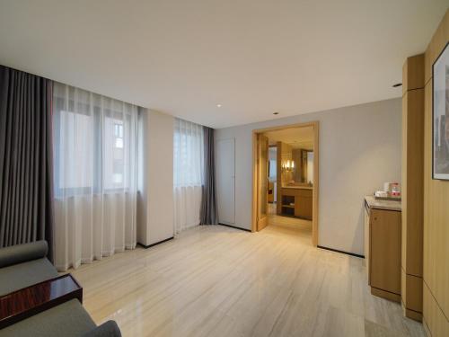 Imagen de la habitación del Hotel Park Inn by Radisson Wenzhou Longwan International Airport Wanda Plaza. Foto 18