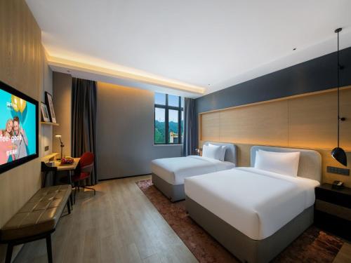 Imagen de la habitación del Hotel Park Inn by Radisson Zhuhai Gaolan Port. Foto 11