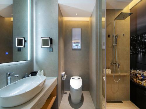 Imagen de la habitación del Hotel Park Inn by Radisson Zhuhai Gaolan Port. Foto 20