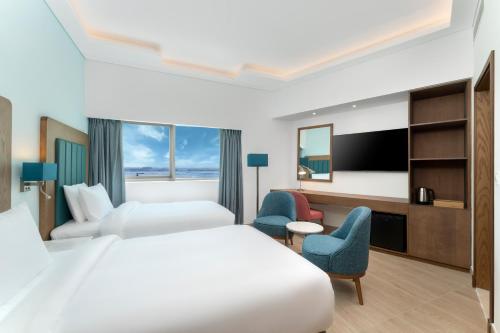 Imagen de la habitación del Hotel Park Regis by Prince Dubai Islands. Foto 16