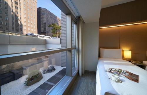 Imagen de la habitación del Hotel Park Taipei. Foto 10