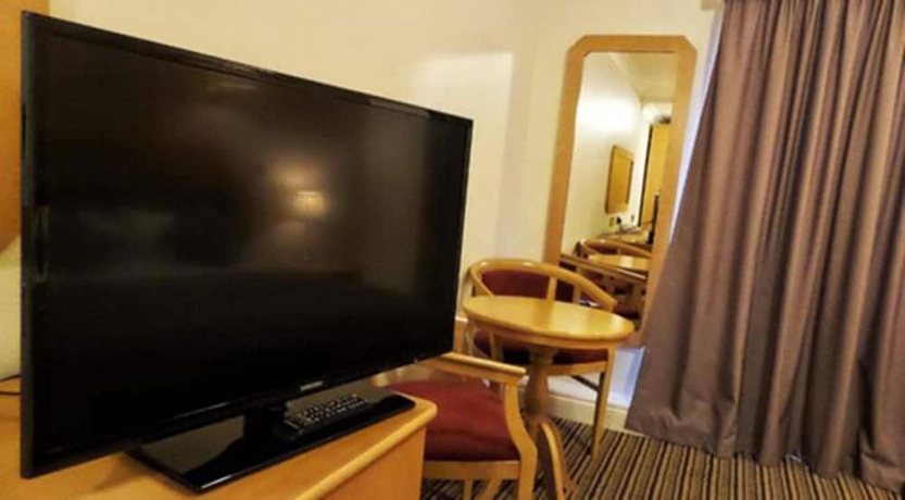 Imagen de la habitación del Hotel Parkside International. Foto 10