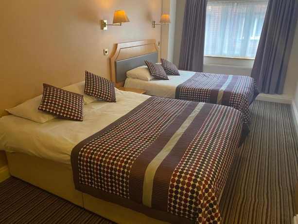 Imagen de la habitación del Hotel Parkside International. Foto 12