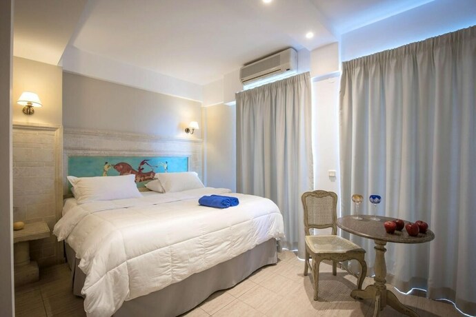 Imagen de la habitación del Hotel Parthenis Beach Suites By The Sea. Foto 25