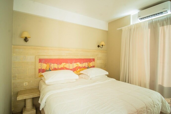Imagen de la habitación del Hotel Parthenis Beach Suites By The Sea. Foto 26