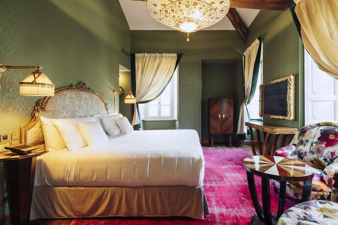 Imagen de la habitación del Hotel Passalacqua. Foto 16