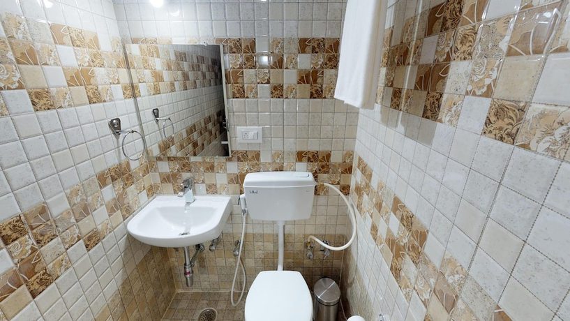 Imagen de la habitación del Hotel Passport Inn - Gateway to Comforts. Foto 13