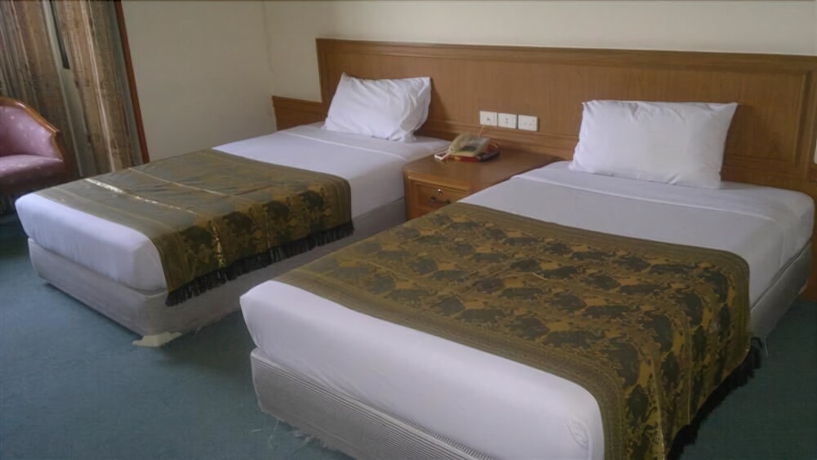 Imagen de la habitación del Hotel Pathumthani Place Hotel. Foto 13