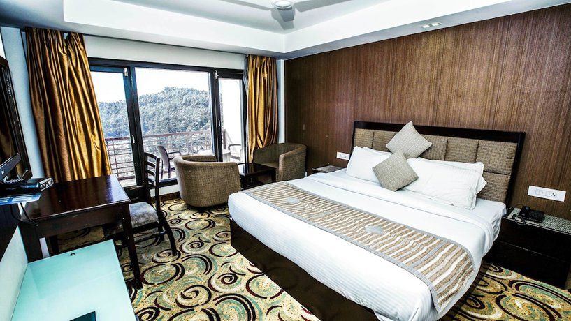 Imagen de la habitación del Hotel Patnitop Heights. Foto 18