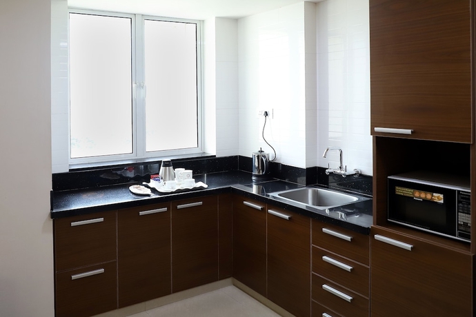 Imagen de la habitación del Hotel Patria Suites, Rajkot. Foto 8