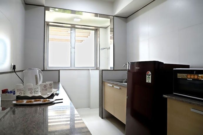 Imagen de la habitación del Hotel Patria Suites, Rajkot. Foto 11