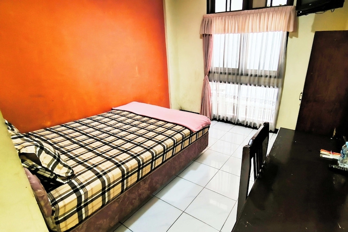 Imagen de la habitación del Hotel Pattimura powered by Cocotel. Foto 11