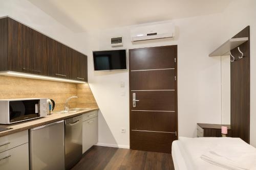 Imagen de la habitación del Hotel Paulay Downtown Apartments. Foto 7